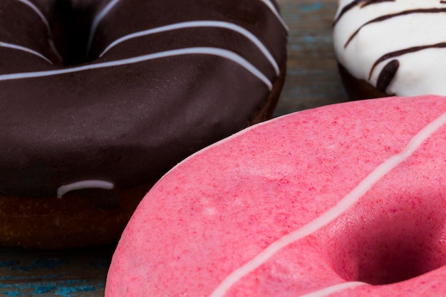 assorted donuts with chocolate frosted, pink glazed donuts.