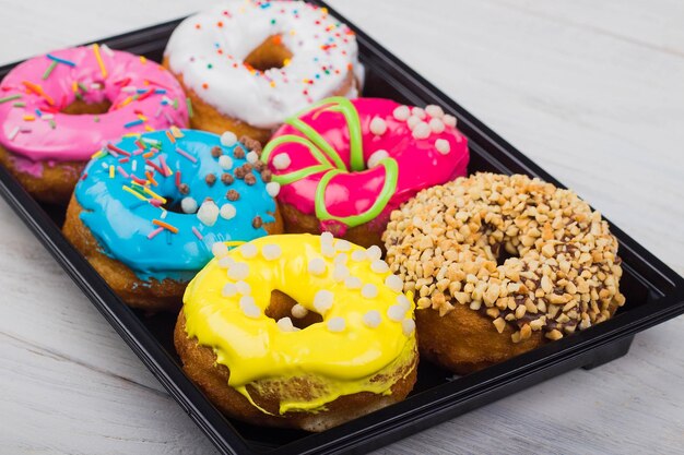 Assorted donuts with different fillings in the box