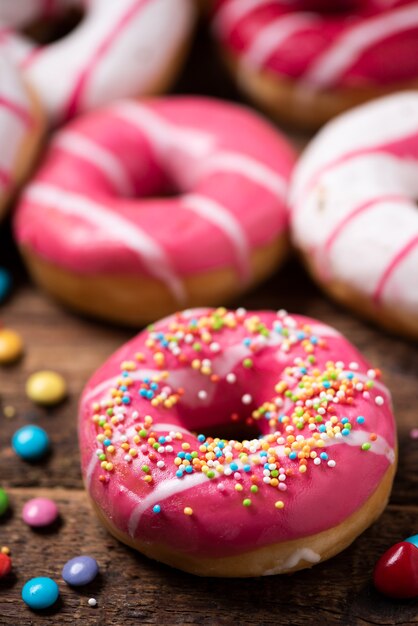 Assorted doughnuts on wooden table