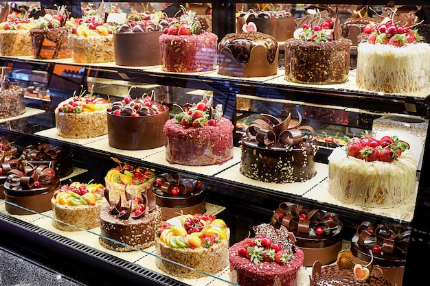 Assorted fancy cakes in a shop-window of a cafe