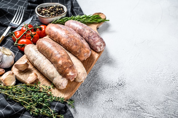 Assorted fresh sausages with thyme, garlic and pepper.