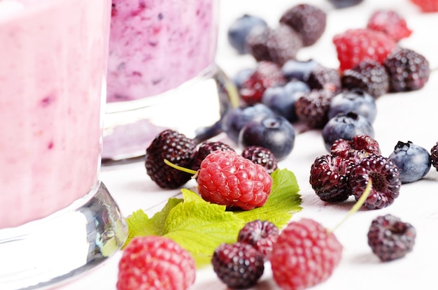 Assorted fruit shakes on white table