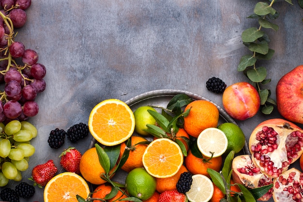 Assorted fruits on a gray background