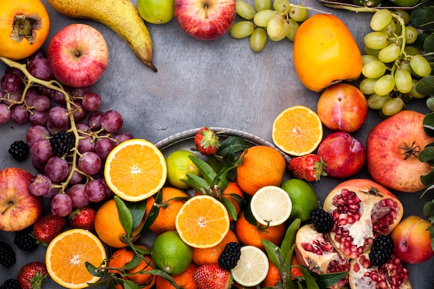 Assorted fruits on a gray background