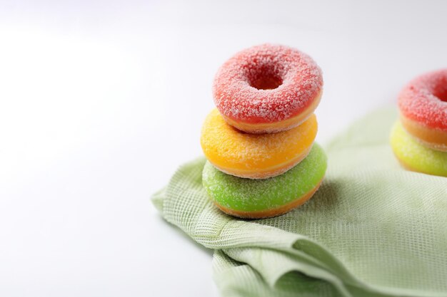 Assorted glazed colorful donut stack on a table