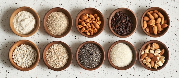 assorted grains nuts and seeds in bowls kitchen tabletop background healthy food concept