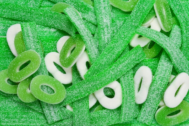 Assorted green gummy candies background. Top view. Jelly  sweets.