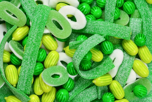 Assorted green gummy candies background. Top view. Jelly  sweets.