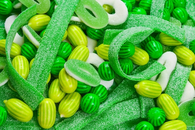 Assorted green gummy candies background Top view Jelly sweets