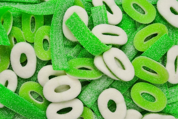 Photo assorted green gummy candies background top view jelly sweets