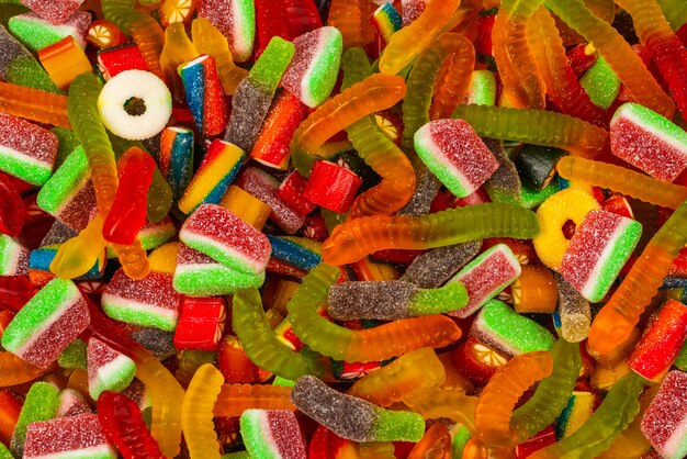 Assorted gummy candies background.