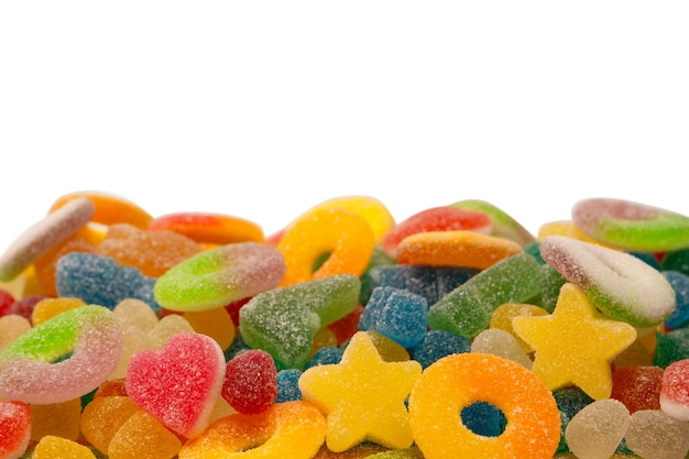 Assorted gummy candies isolated on a white background Top view