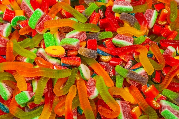 Assorted gummy candies top view jelly sweets background