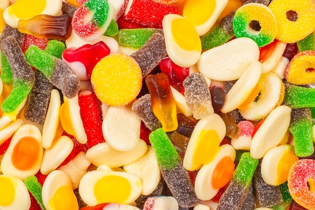 Assorted gummy candies. Top view. Jelly  sweets. Isolated on white.