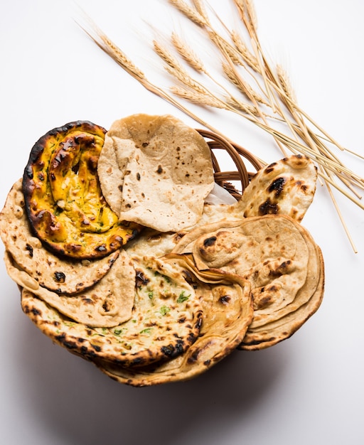 Assorted Indian Bread Basket includes chapati, tandoori roti or naan, paratha, kulcha, fulka, missi roti