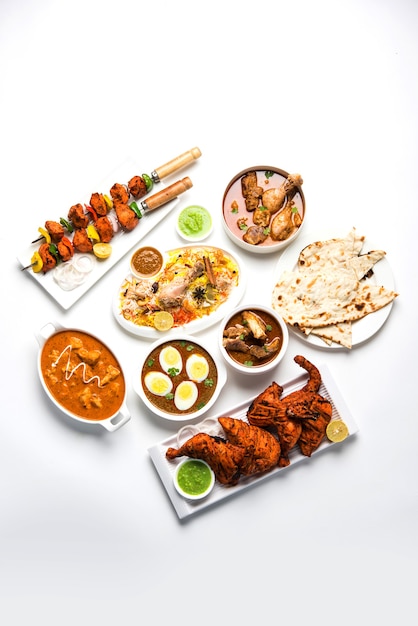 Assorted Indian Non Vegetarian food recipe served in a group. Includes Chicken Curry, Mutton Masala, Anda or egg curry, Butter chicken, biryani, tandoori murg, chicken-tikka and naa, roti for ramadan