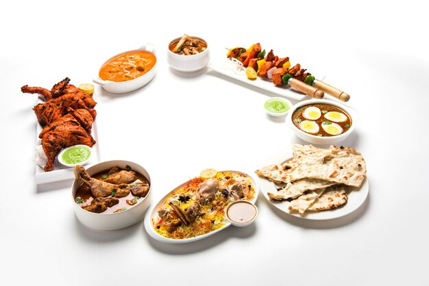 Assorted Indian Non Vegetarian food recipe served in a group. Includes Chicken Curry, Mutton Masala, Anda or egg curry, Butter chicken, biryani, tandoori murg, chicken-tikka and naa, roti for ramadan