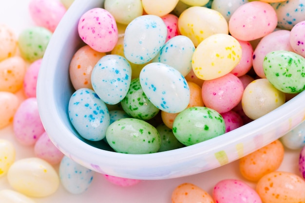 Assorted jelly beans in pastel colors with darker spots.