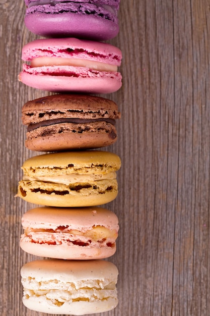 Assorted macaroons over old wood