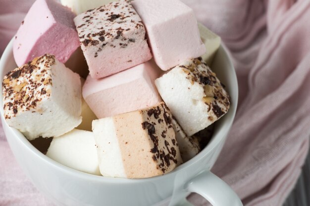 Assorted marshmallow on a gray table