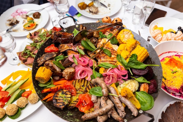 Assorted meat and vegetables fried in a wok