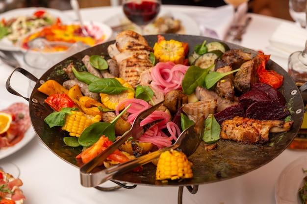 Assorted meat and vegetables fried in a wok