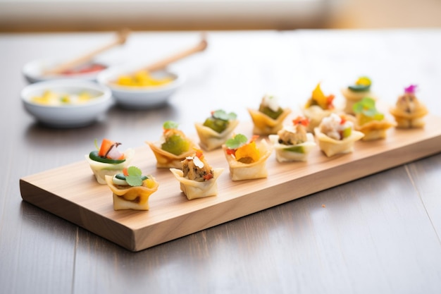 Assorted mini samosas on a wooden board