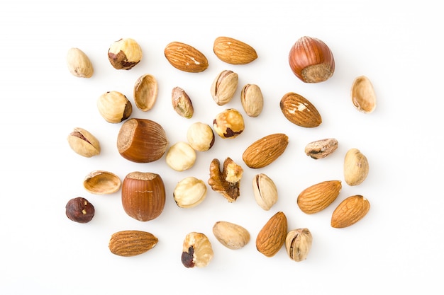 Assorted mixed nuts pattern isolated on white background Top view