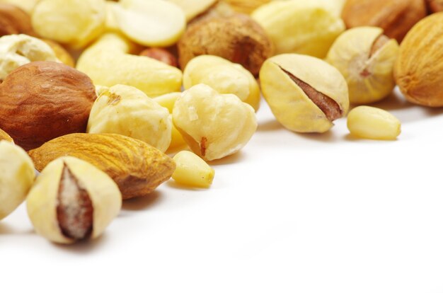 Assorted mixed nuts on white background