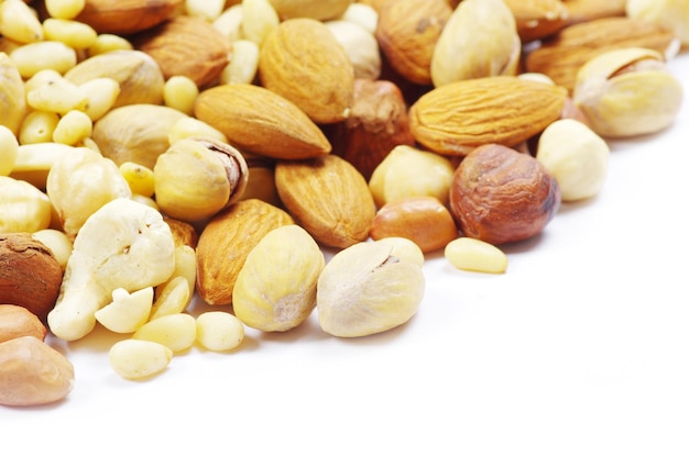 Assorted mixed nuts on white background