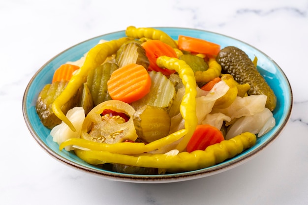 Assorted mixed pickled vegetables in bowl - plate, Turkish name; tursu.