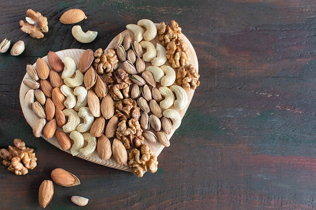 assorted nuts in the shape of a hearthealthy food useful microelements and vitamins