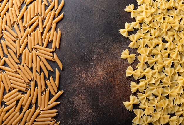 Assorted pasta on a dark background