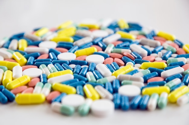 Assorted pharmaceutical medicine pills and capsules on the table