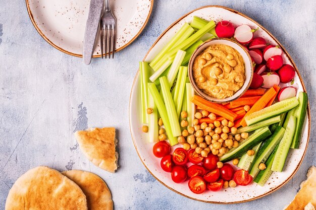 Assorted raw vegetables with homemade hummus