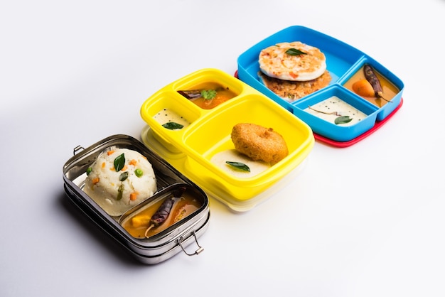 Assorted South Indian tiffin, lunch box food in group, includes idli vada, uttapam, uthappam, upma with sambar and chutney