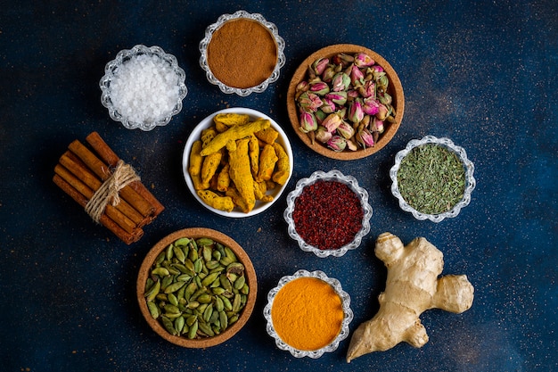 Assorted spices on dark black