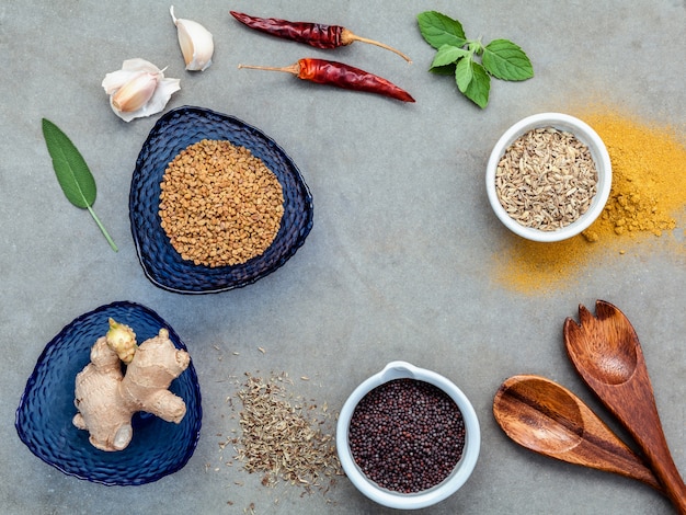 Assorted of spices setup on concrete background.