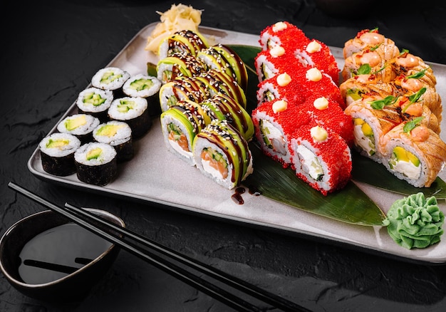 Assorted sushi platter on dark table