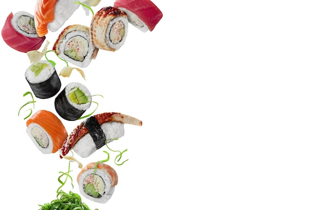 Assorted sushi with pickled ginger and wakame hovering on white background