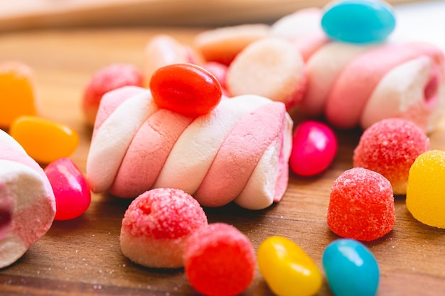 Assorted sweets on a wooden board in macro photography