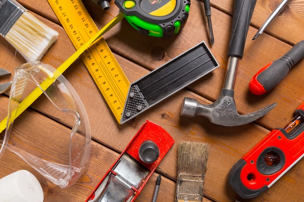 Assorted work tools on wood table