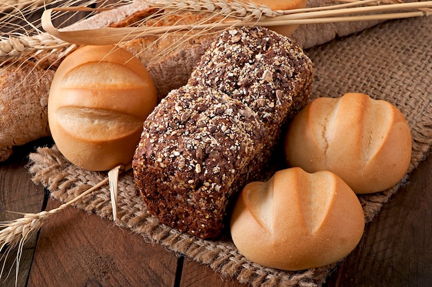 Assortment of baked bread on a wooden table