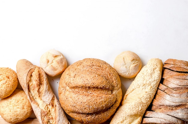 Assortment of baked goods on white background