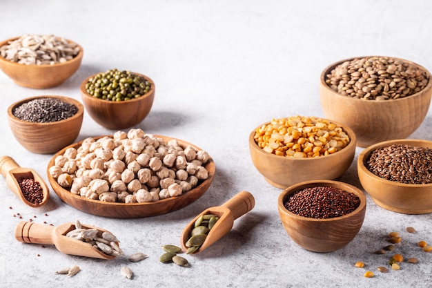 Assortment of beans, seeds, legumes on white background.