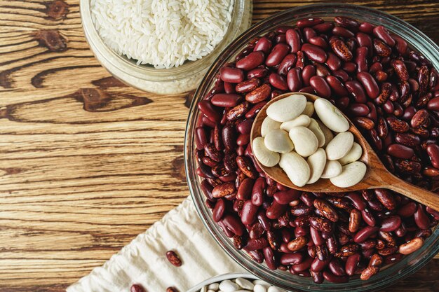 Assortment of beans on wooden background. Close up.