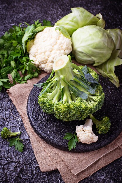 Assortment of cabbages on concrete background