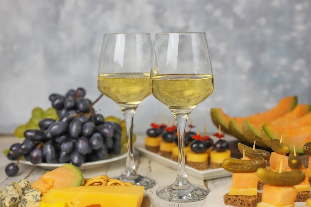 Assortment of canapes on white table.