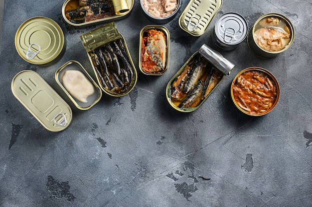 Assortment of cans of canned with different types of fish and seafood