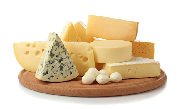 assortment of cheese on wooden board isolated on white